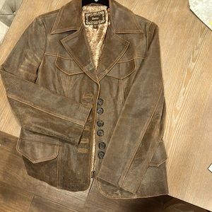 Guess distressed high quality leather.  Ladies size M